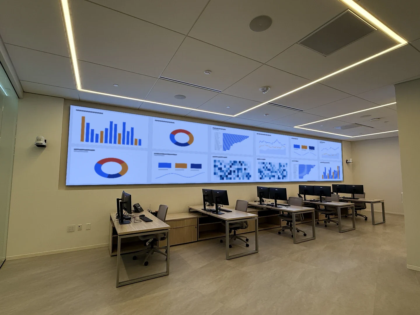 Wide view of Command Center 114 with the Absen LED video wall, workstations and ceiling-mounted audiovisual systems.