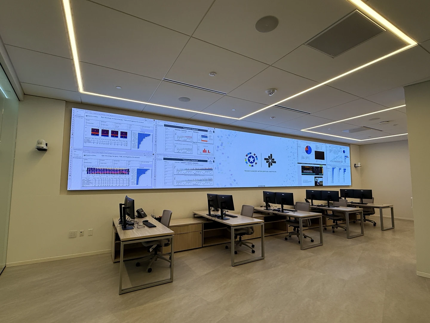 Wide view of Command Center 114 with the Absen LED video wall, workstations and ceiling-mounted audiovisual systems.