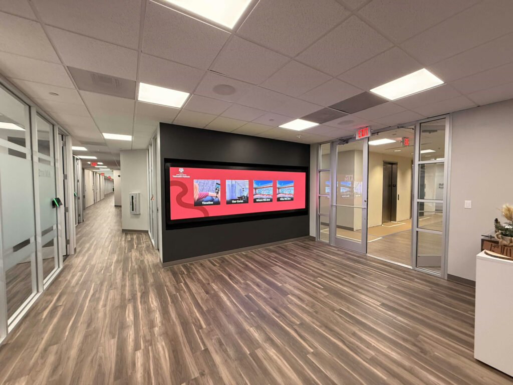 Corridor view of the Texas A&M Telehealth Institute LED video wall